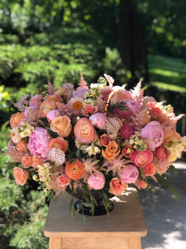 Peach and pink high-quality floral arrangement by Bedford Village Flower Shoppe